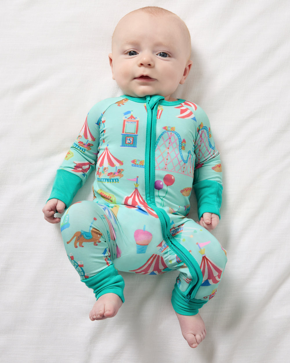 Aerial view of newborn wearing the Fizzy Fair Zippy