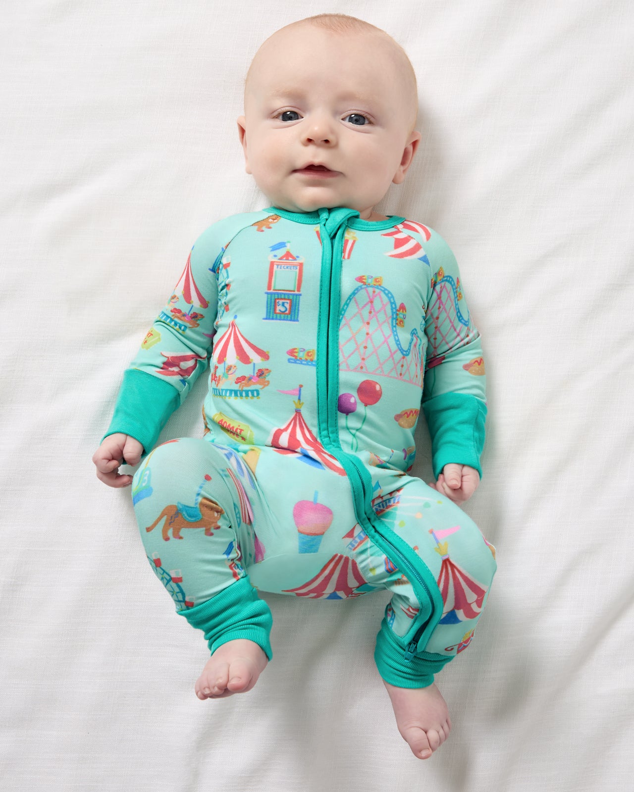 Aerial view of newborn wearing the Fizzy Fair Zippy