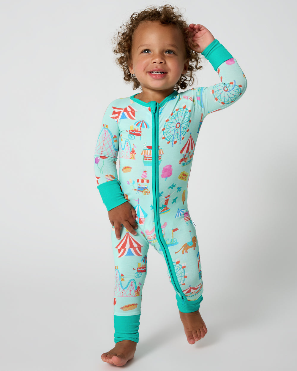 Walking toddler wearing the Fizzy Fair Zippy