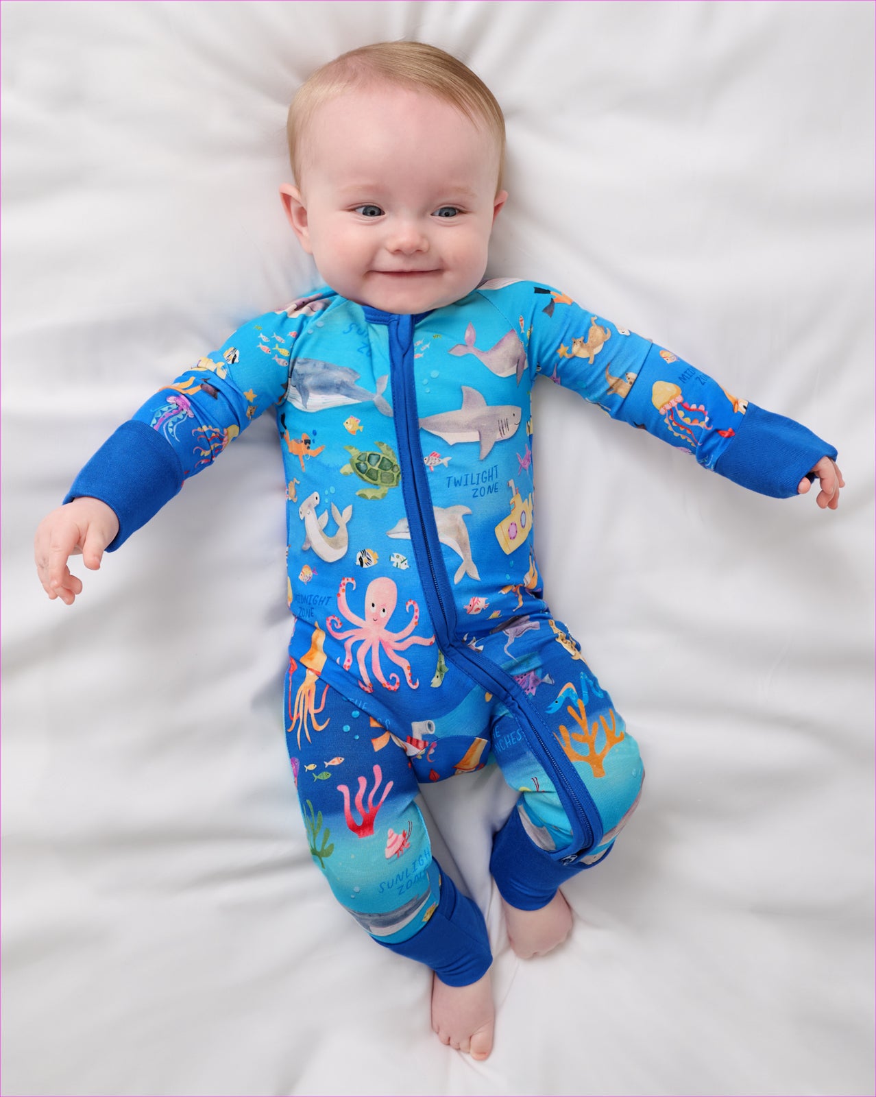 Aerial view of baby wearing the Underwater Discovery Zippy