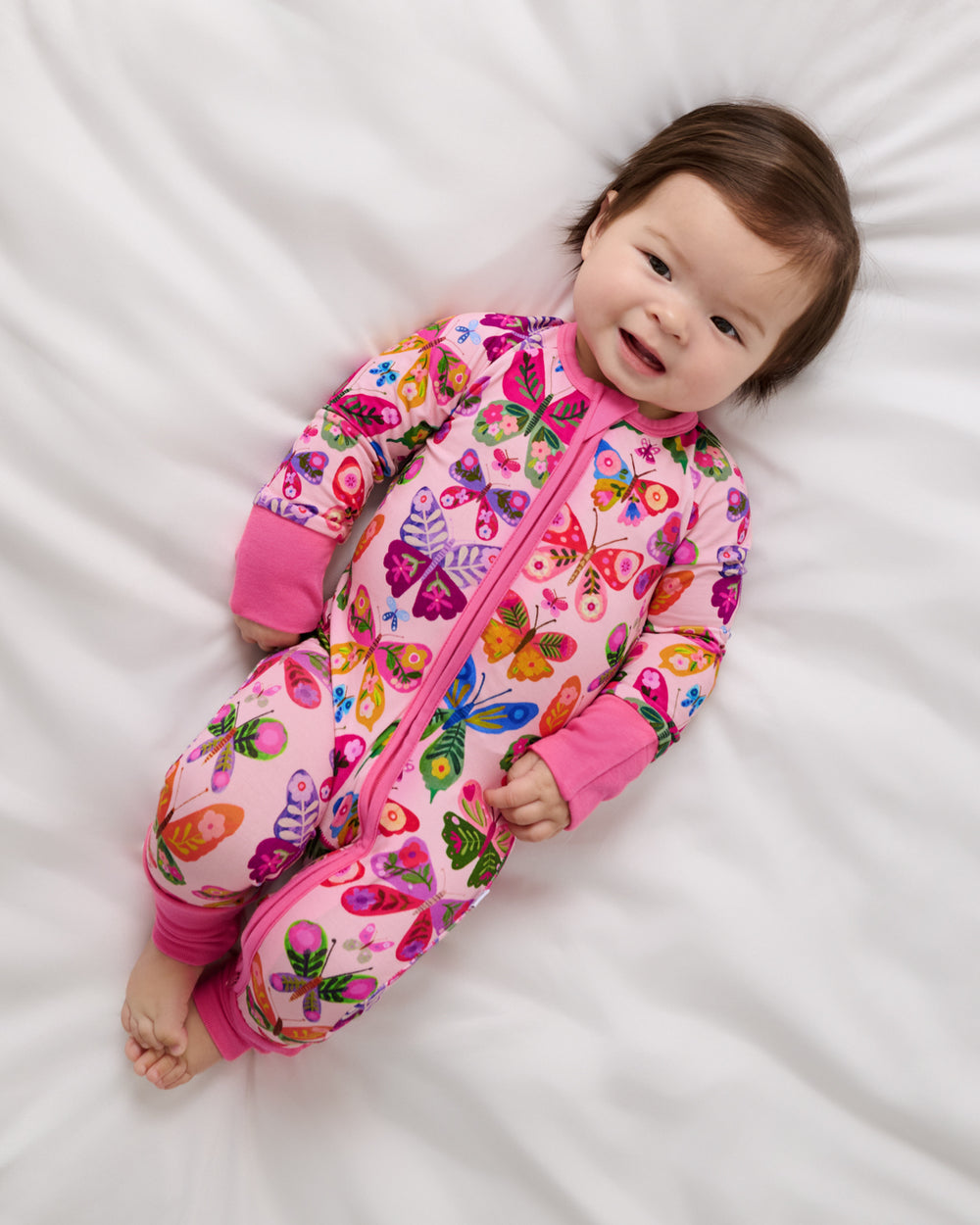 Aerial view of baby wearing the Flutter Garden Zippy