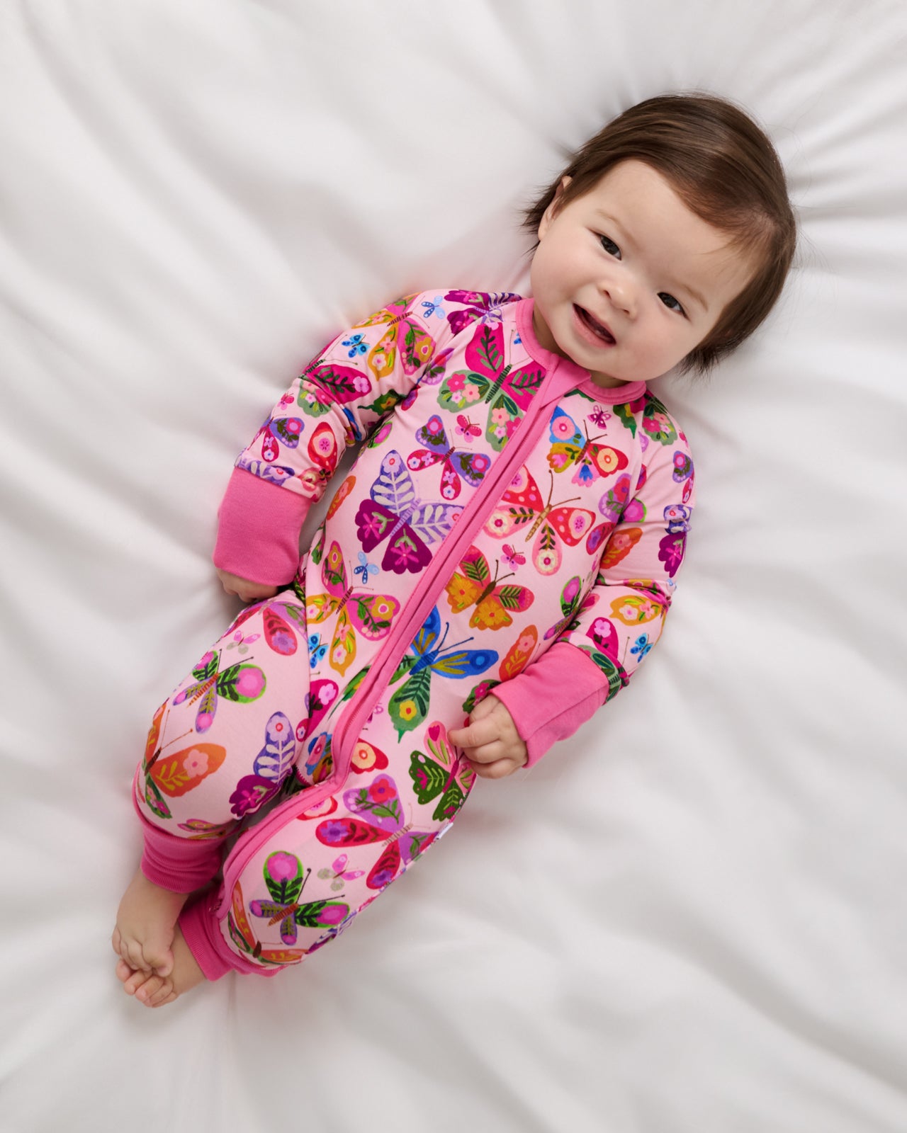 Aerial view of baby wearing the Flutter Garden Zippy