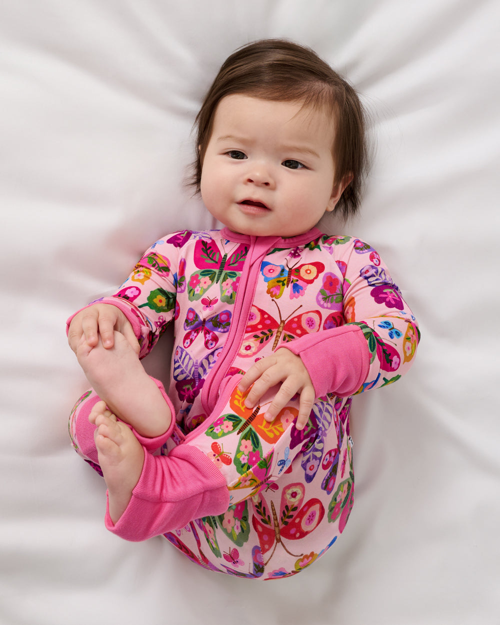 Aerial view of alternate baby wearing the Flutter Garden Zippy