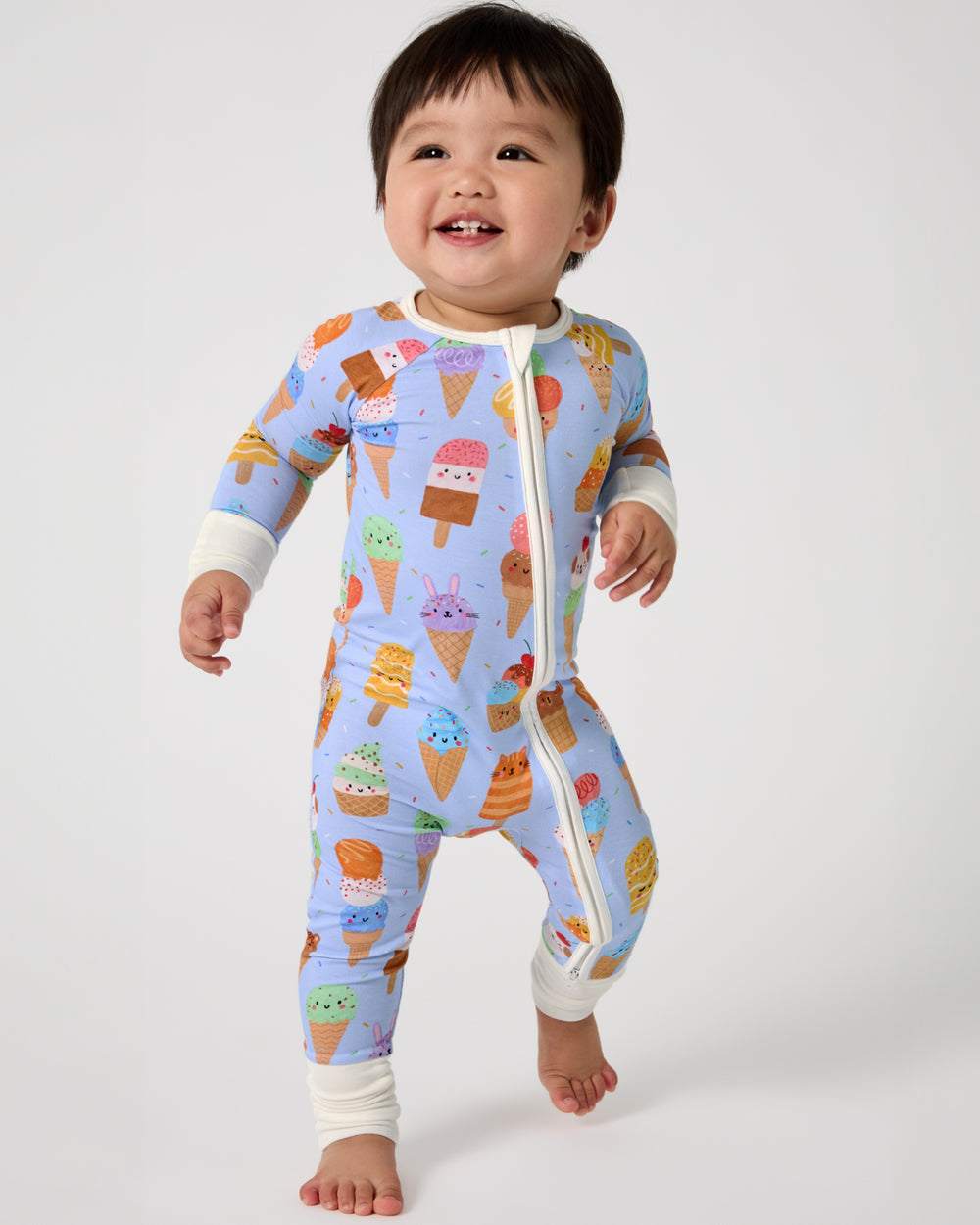 Walking baby wearing the Scoop Squad Zippy