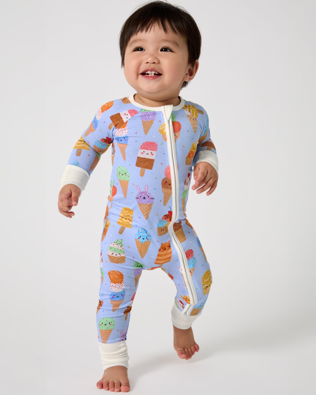 Walking baby wearing the Scoop Squad Zippy