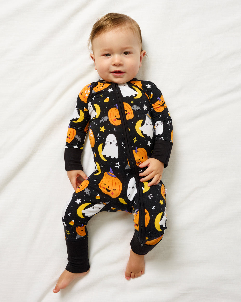 Aerial view of baby wearing the Moonlit Magic Zippy