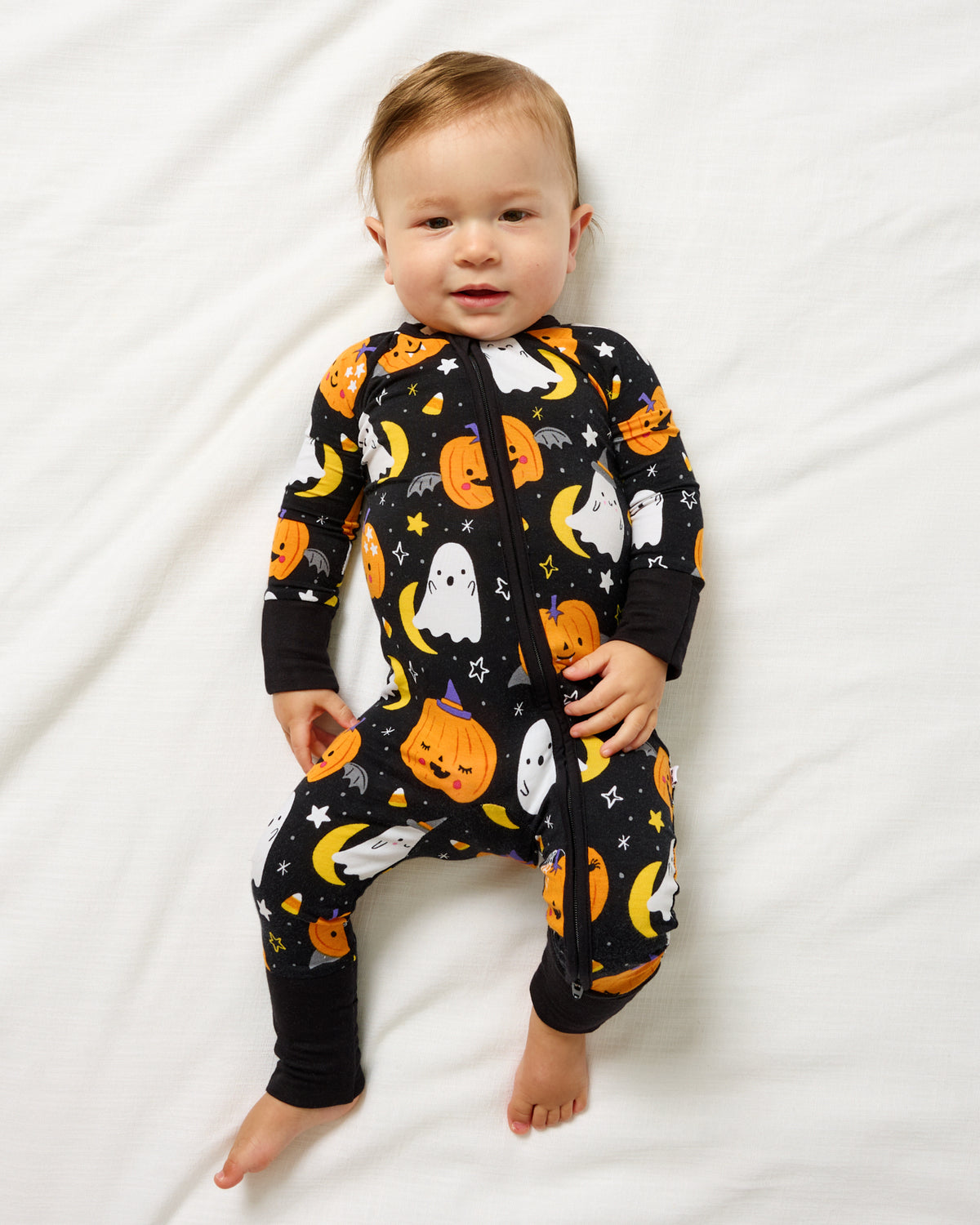 Aerial view of baby wearing the Moonlit Magic Zippy