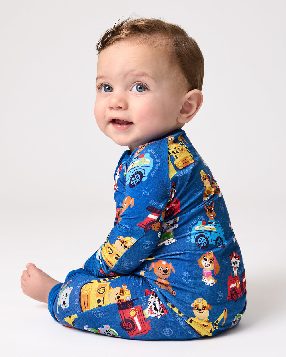 Side view of baby wearing the Blue PAW Patrol Adventure Bay Heroes Zippy