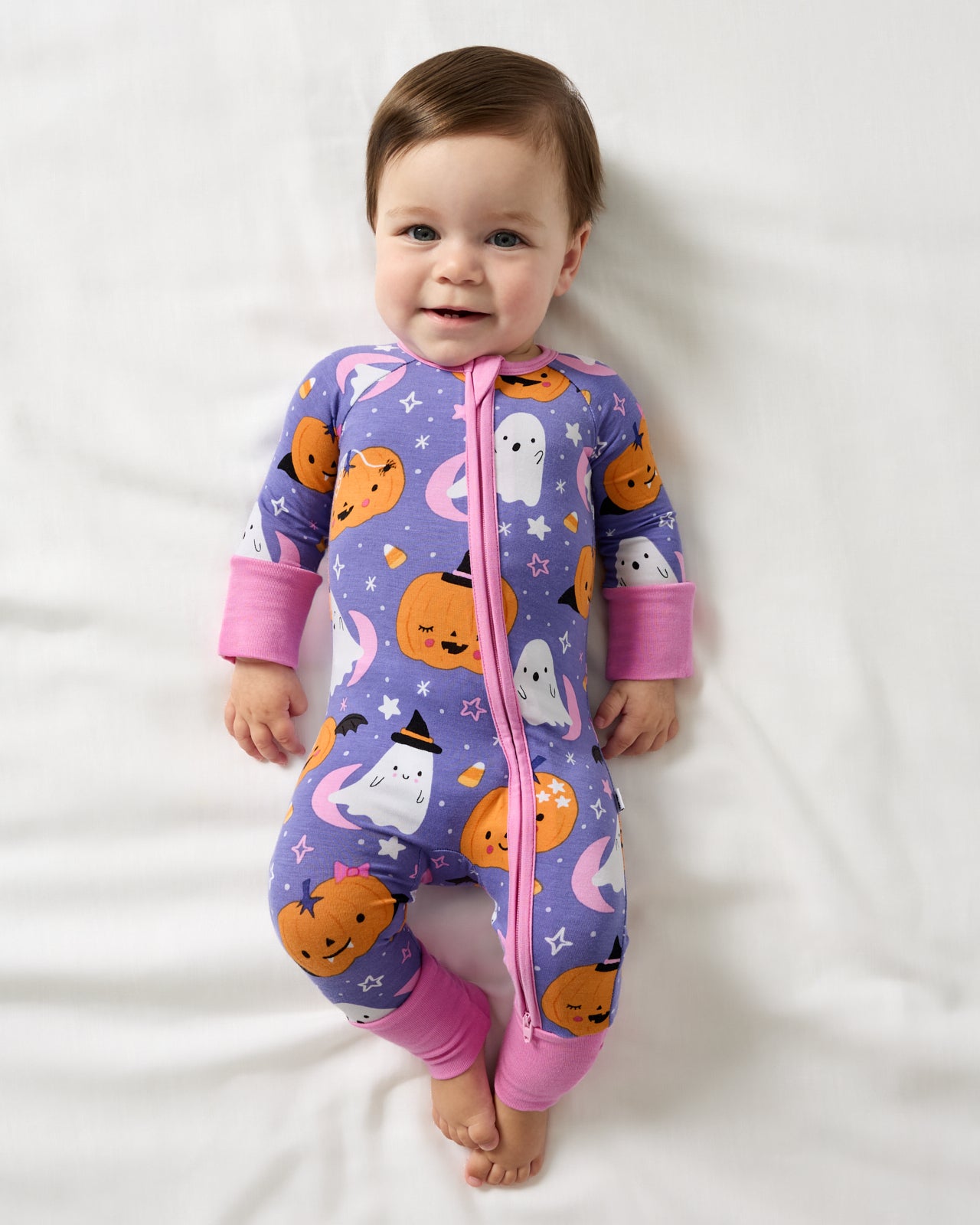 Aerial view of baby wearing the Moonlit Magic Purple Zippy