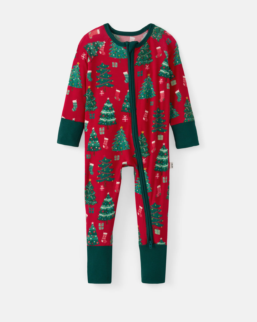 A baby's full-zip footless pajama romper in red with a green Christmas tree and gift pattern, featuring solid dark green cuffs and leg cuffs, shown on a light gray background.