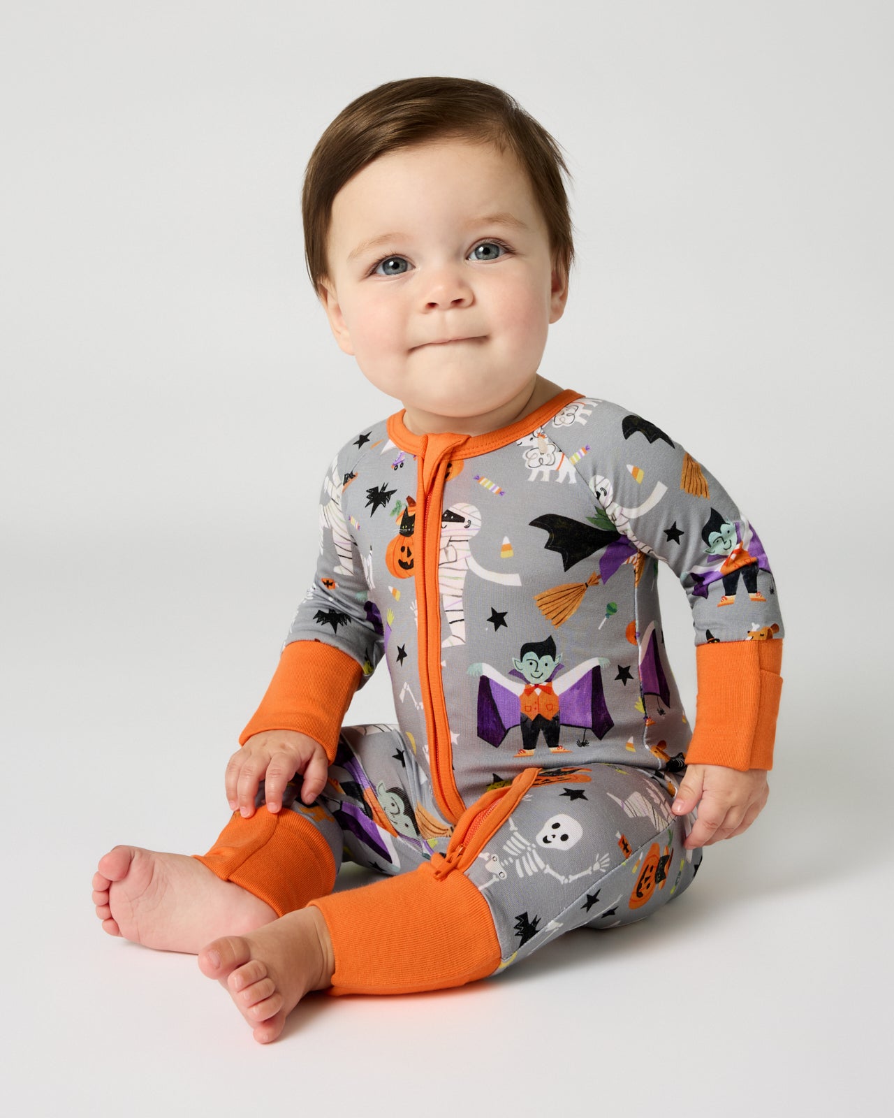 Sitting baby wearing the Dracula's Disco Zippy