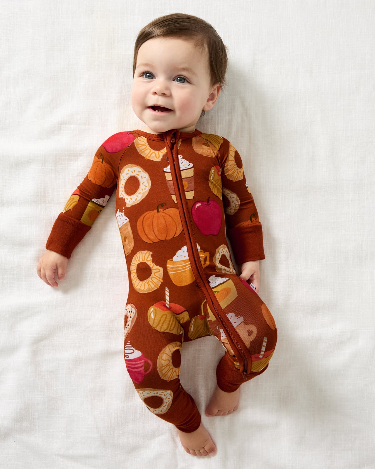 Aerial view of baby wearing the Harvest Sweets Zippy