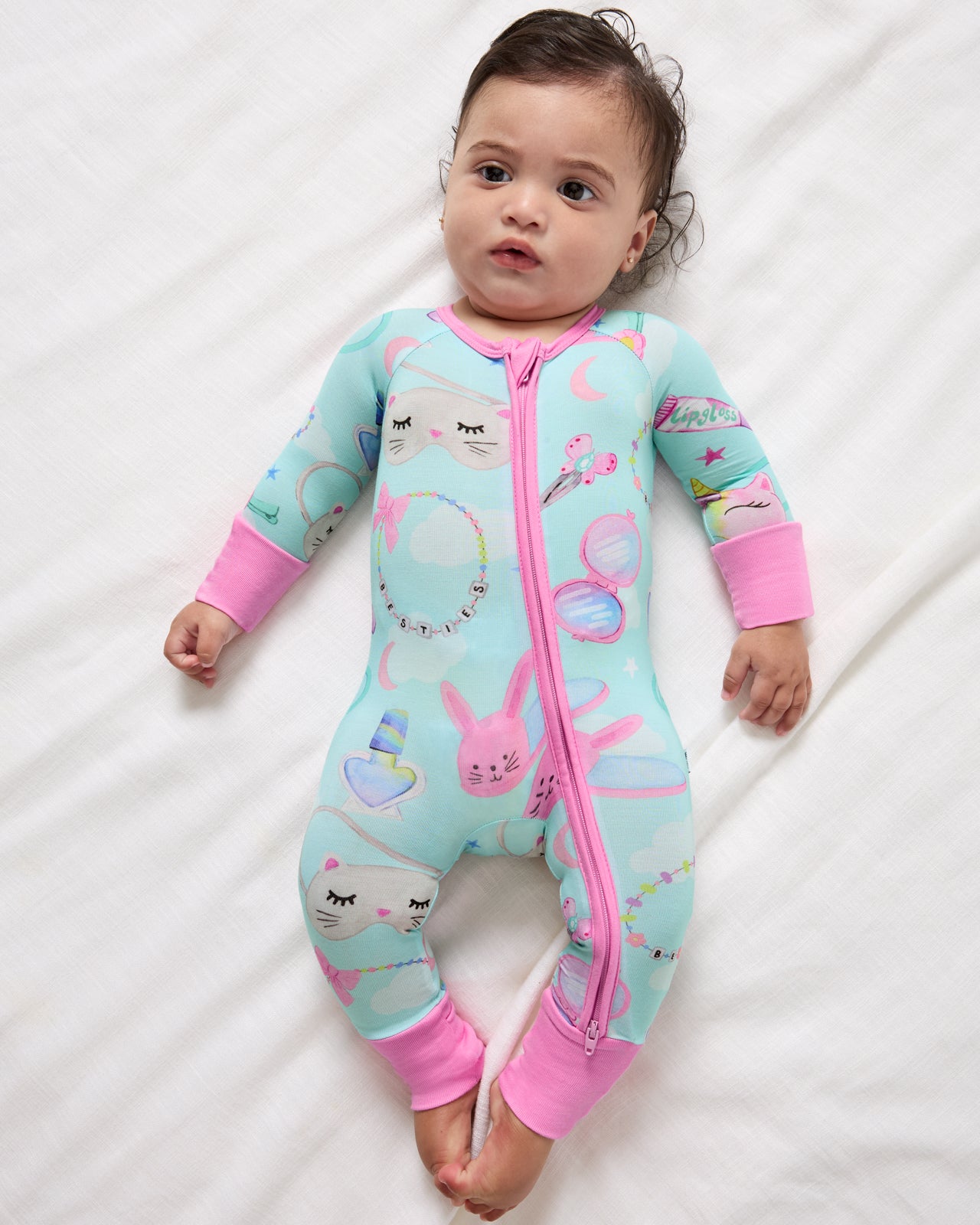 Newborn wearing the Slumber Club Zippy 