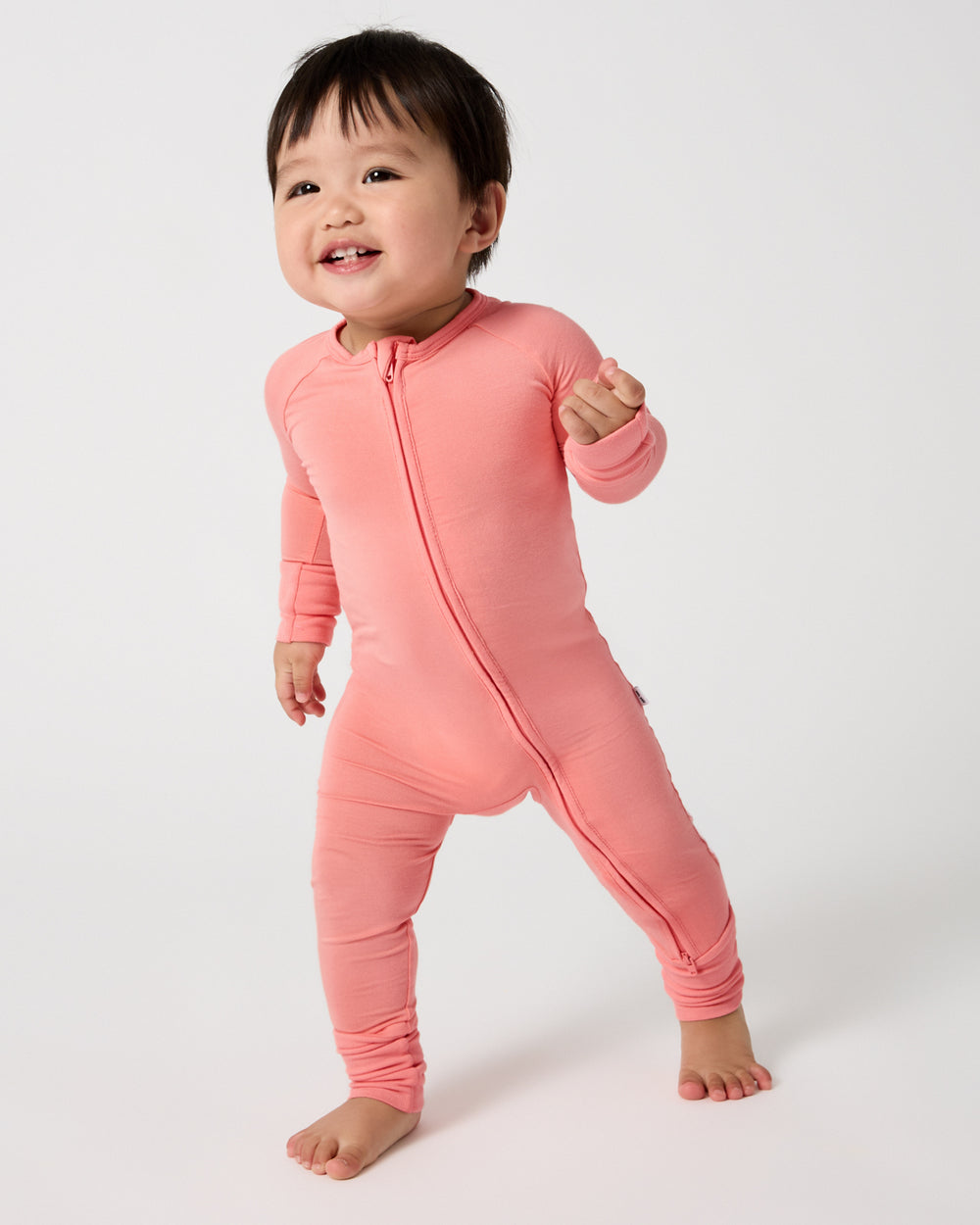 Walking baby wearing the Sweet Papaya Zippy PJ