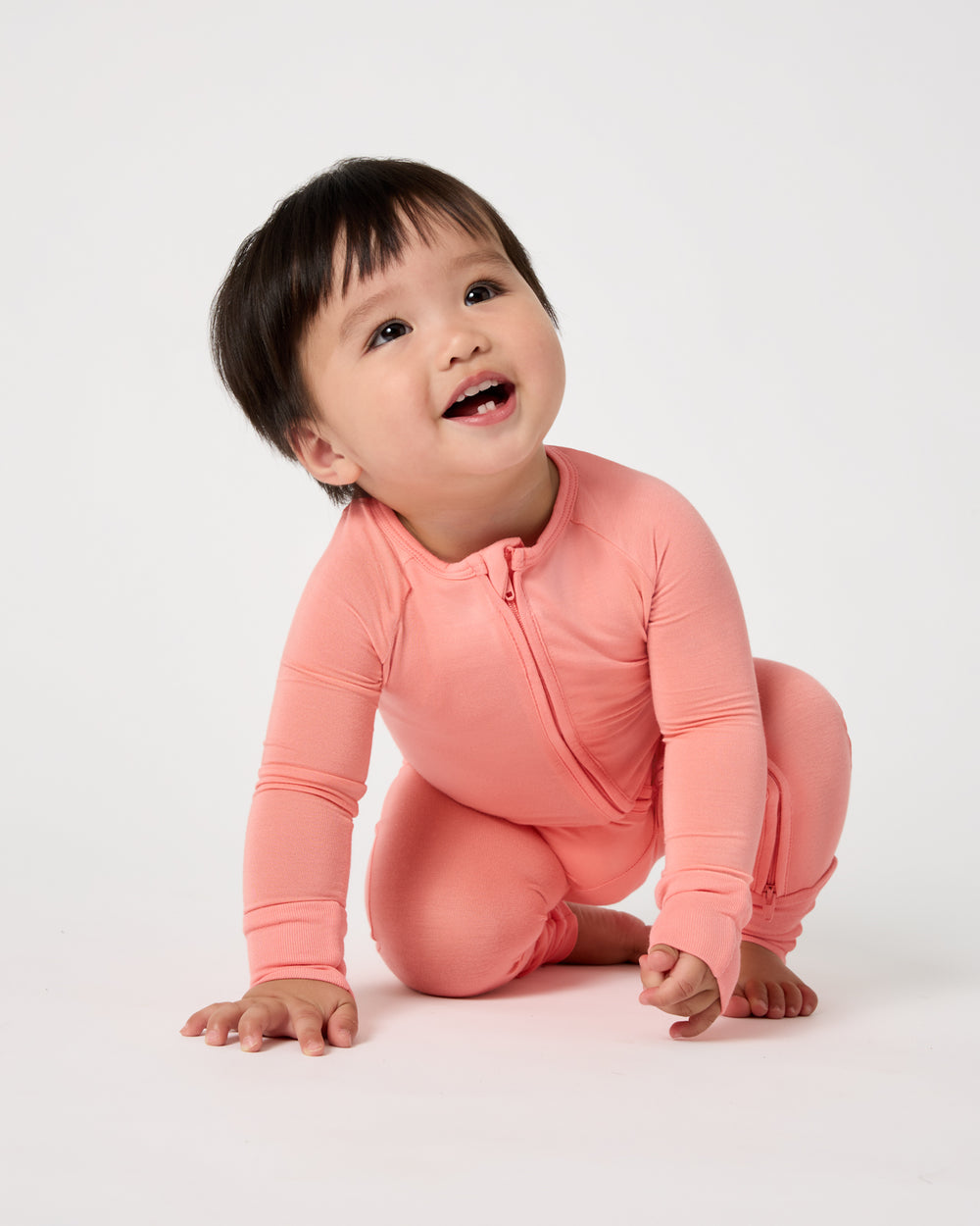 Crawling baby wearing the Sweet Papaya Zippy Pajama