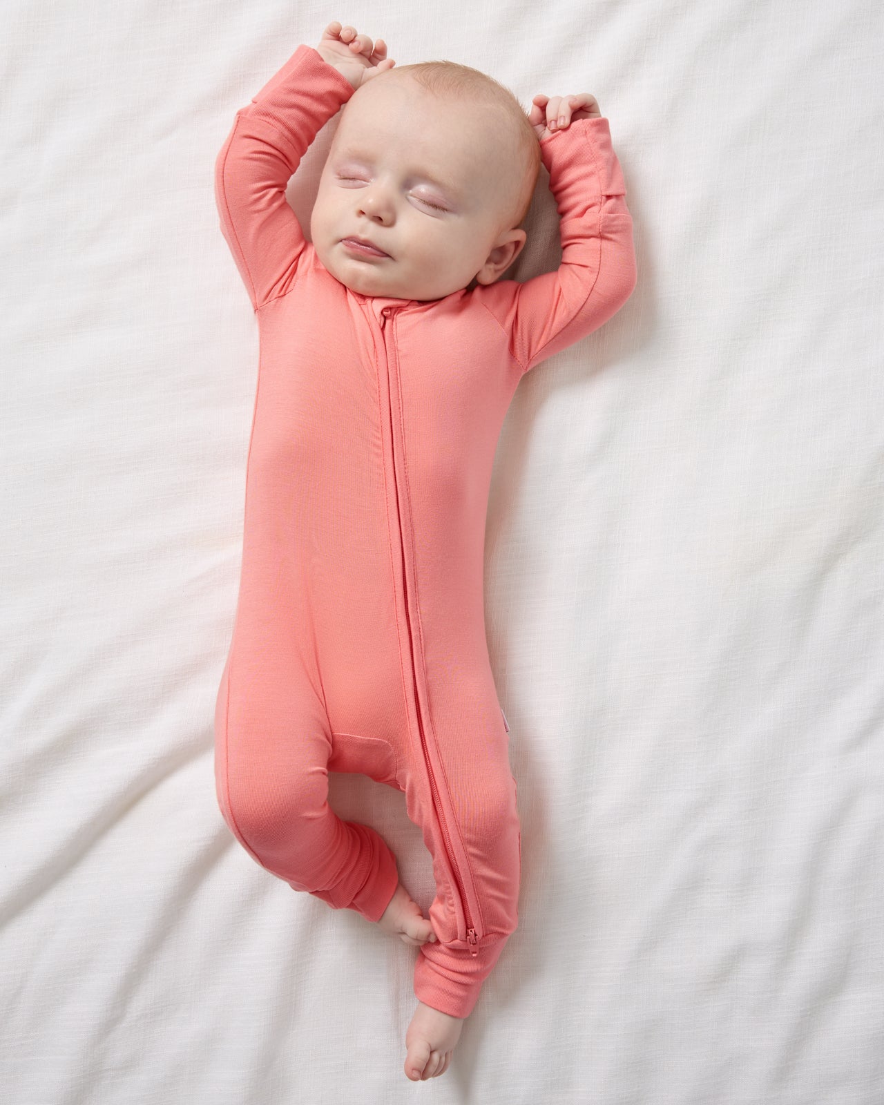Aerial view of sleeping newborn in the Sweet Papaya Zippy