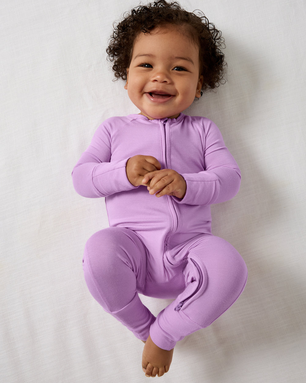 Aerial view of baby wearing the Soft Wisteria Zippy