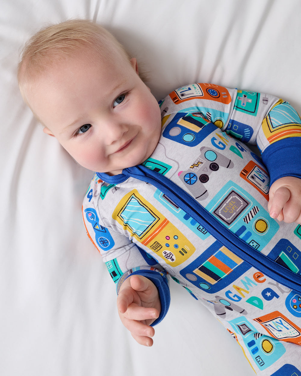 Overhead view of baby wearing the Game On Zippy