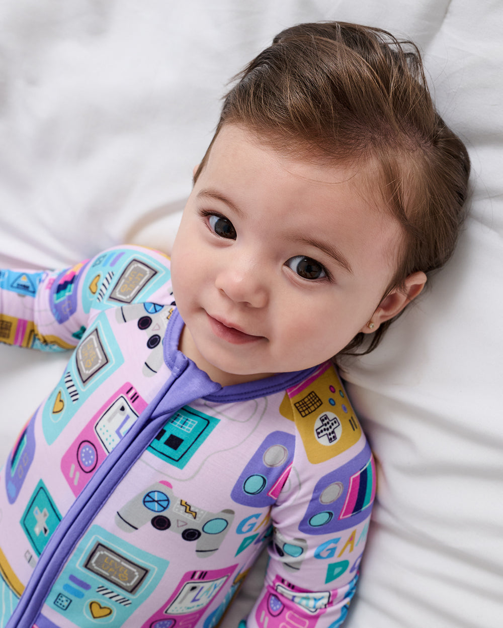 Close up of baby wearing the Purple Game On Zippy