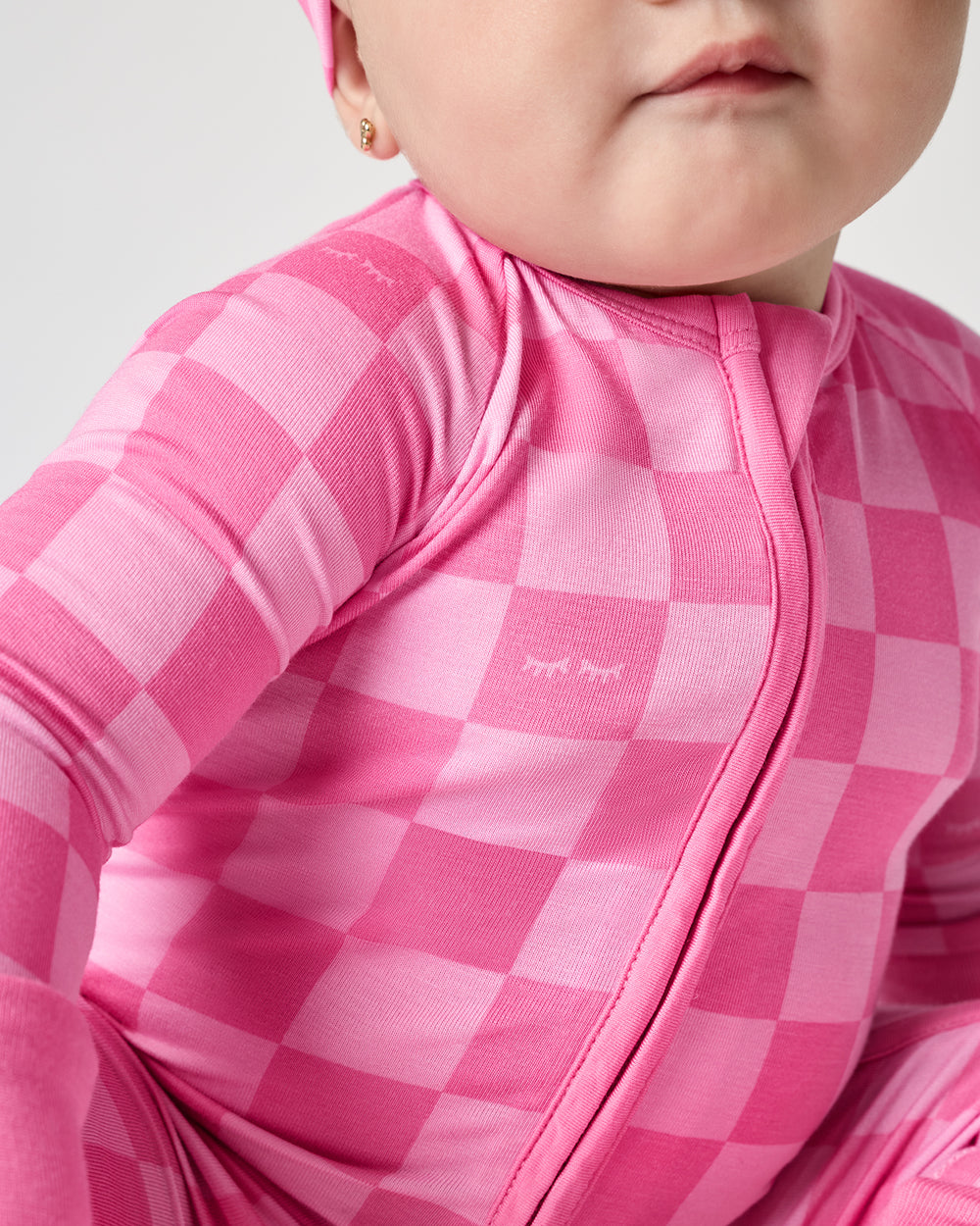 Close up of the zipper detail on the Sweet Raspberry Checks Zippy