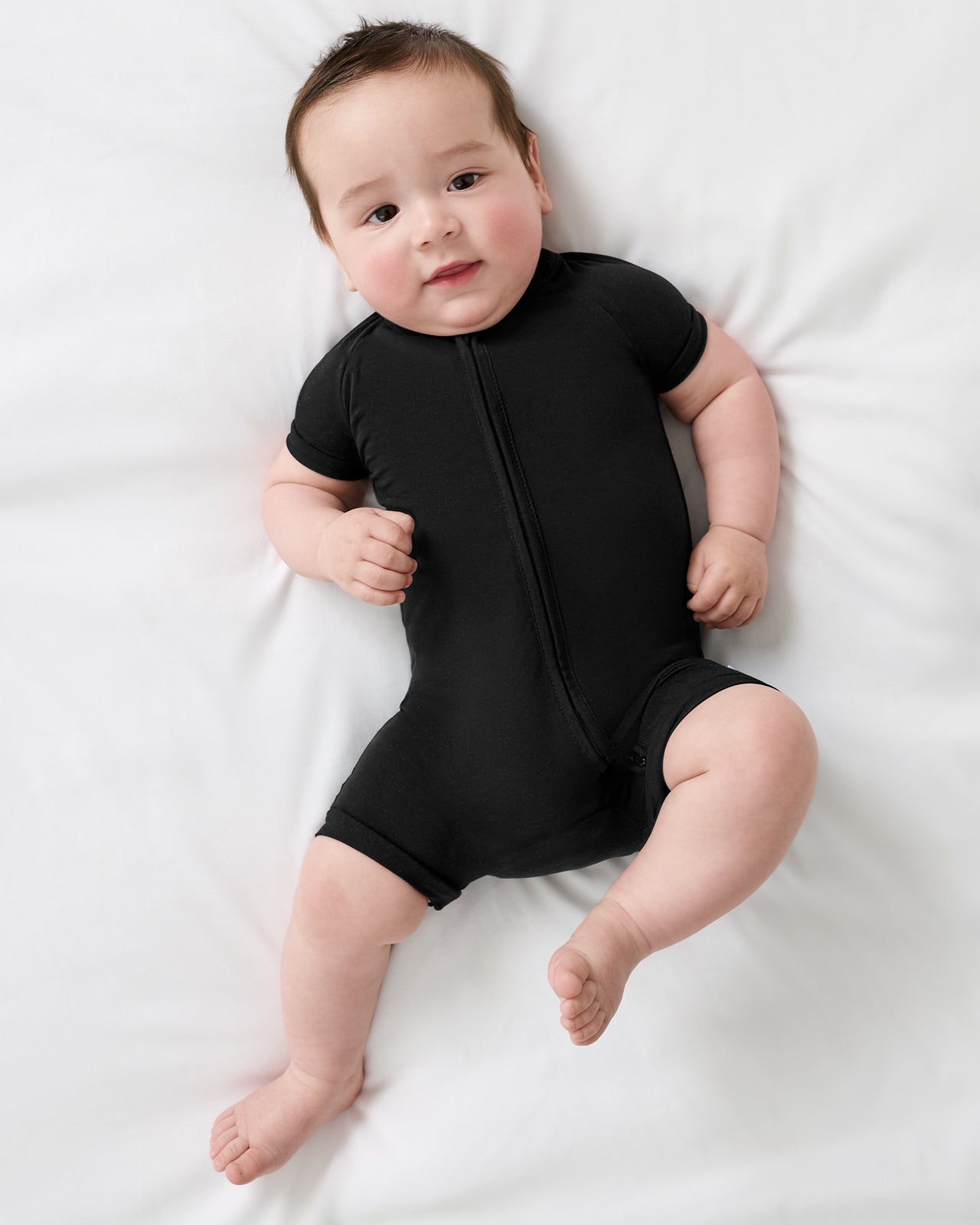 Aerial view of baby wearing the Black Shorty Zippy