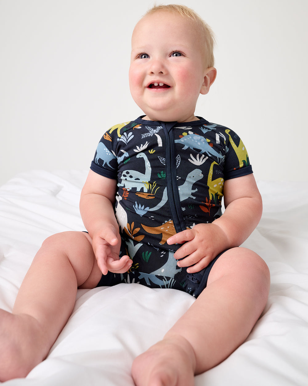 Alternate of sitting baby boy wearing the Navy Jurassic Jungle Shorty Zippy