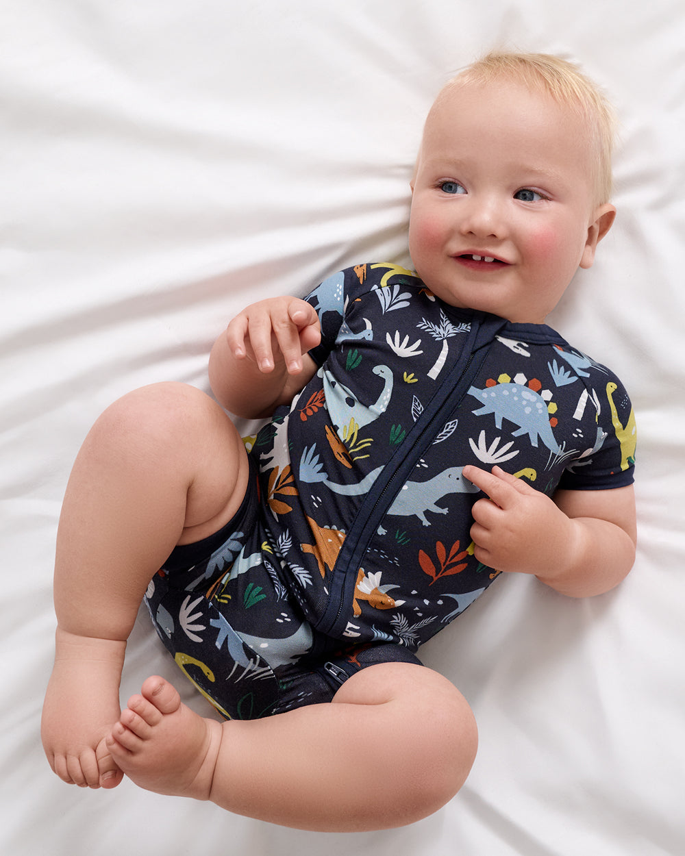 Aerial view of baby wearing the Navy Jurassic Jungle Shorty Zippy