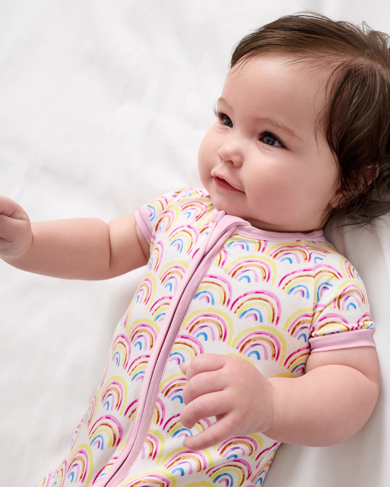 Close up of baby girl wearing the Pastel Rainbows Shorty Zippy