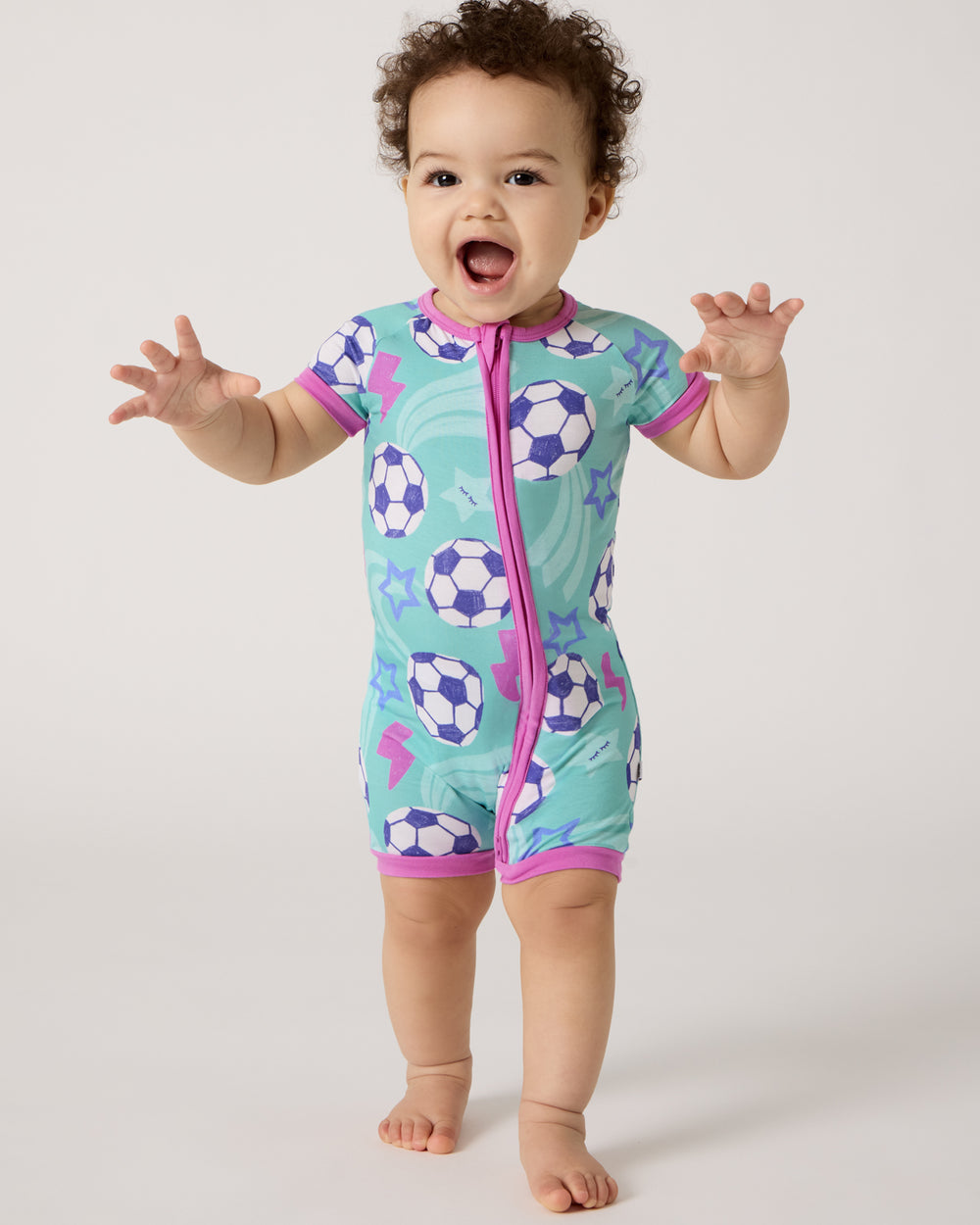 Posing baby wearing the Aqua Soccer Stars Shorty Zippy
