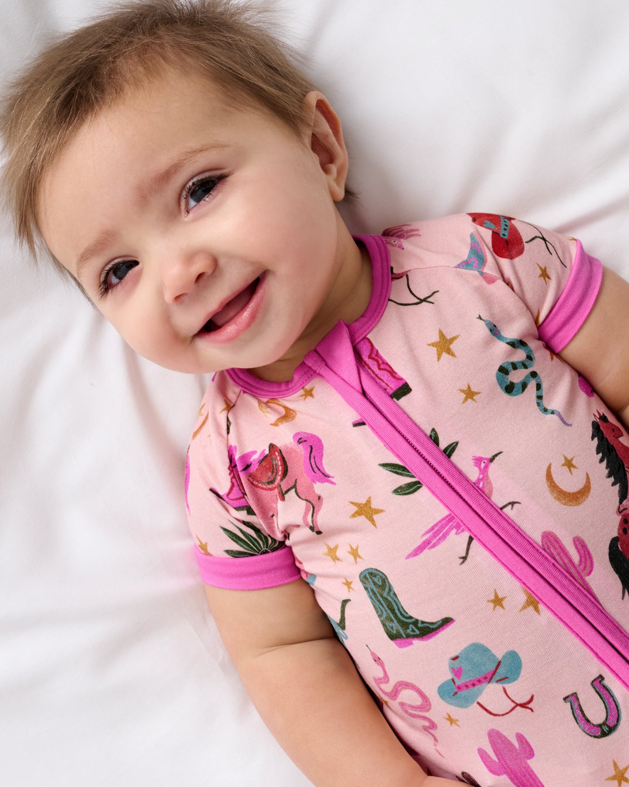 Close up of baby wearing the Pink Rancher Roundup Shorty Zippy