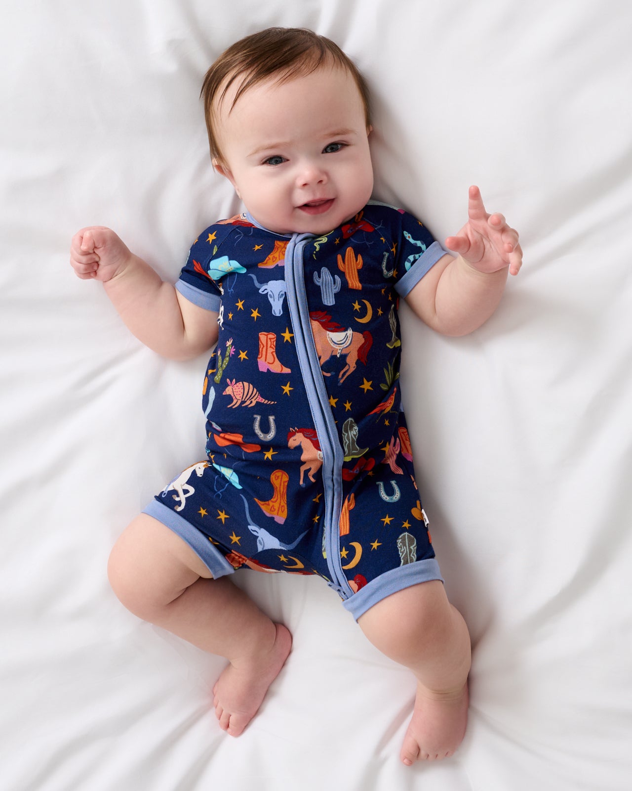 Aerial view of baby wearing the Blue Rancher Roundup Shorty Zippy