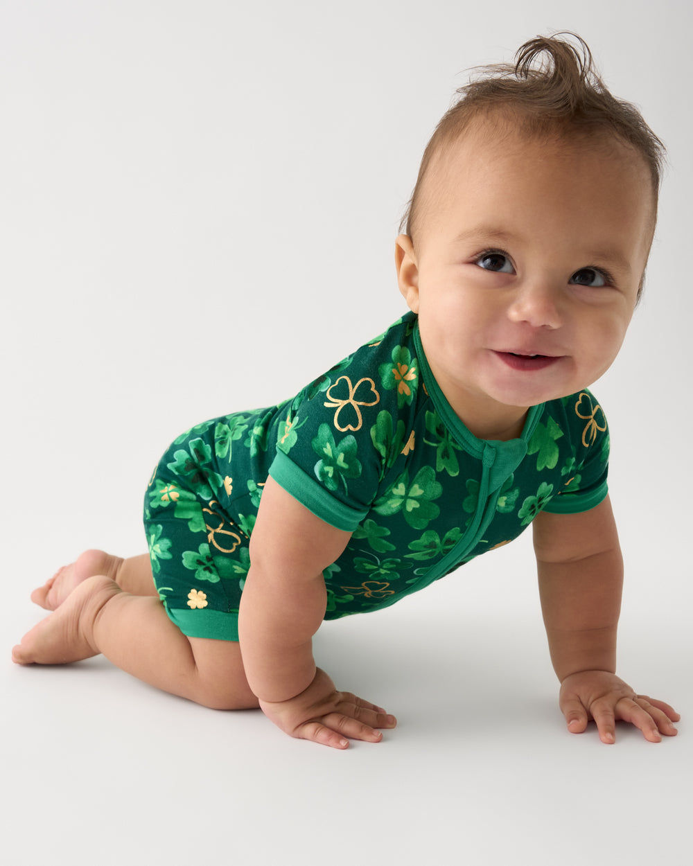 Crawling baby wearing the Clover Cuties Shorty Zippy