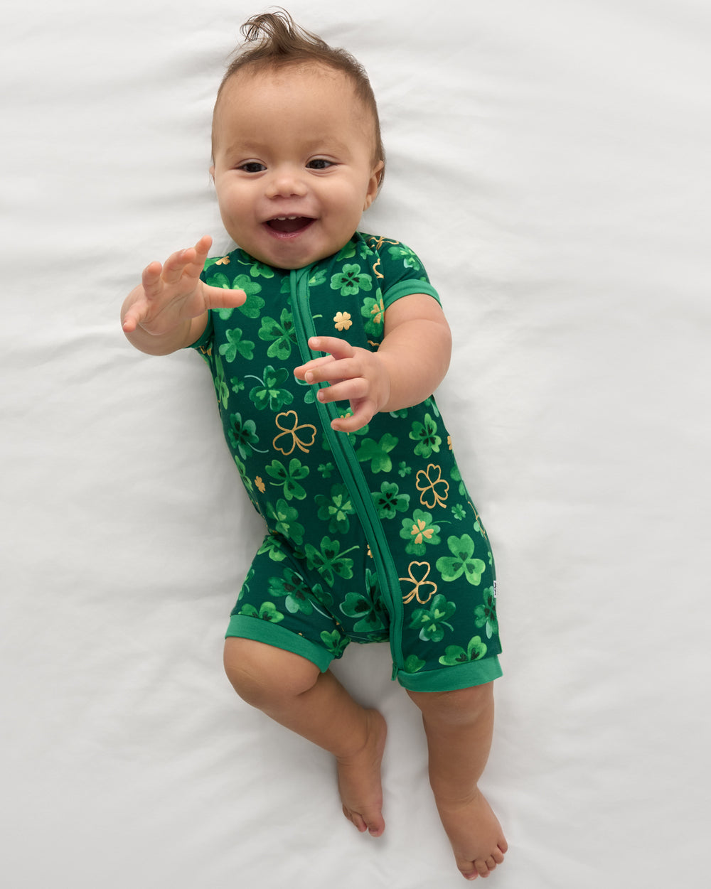 Aerial view of baby wearing the Clover Cuties Shorty Zippy