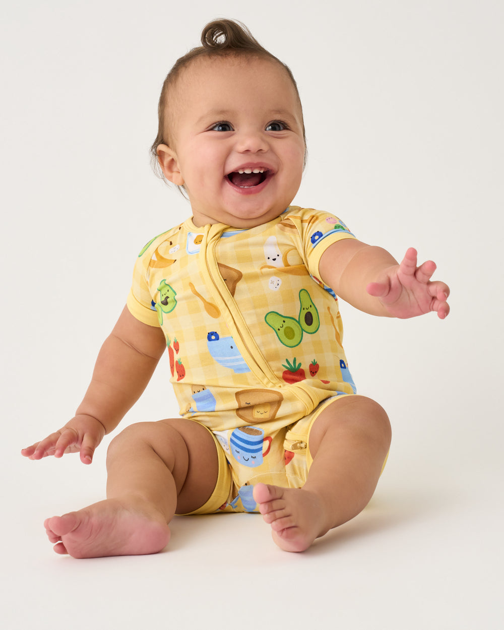 Sitting baby wearing the Breakfast Bunch Shorty Zippy