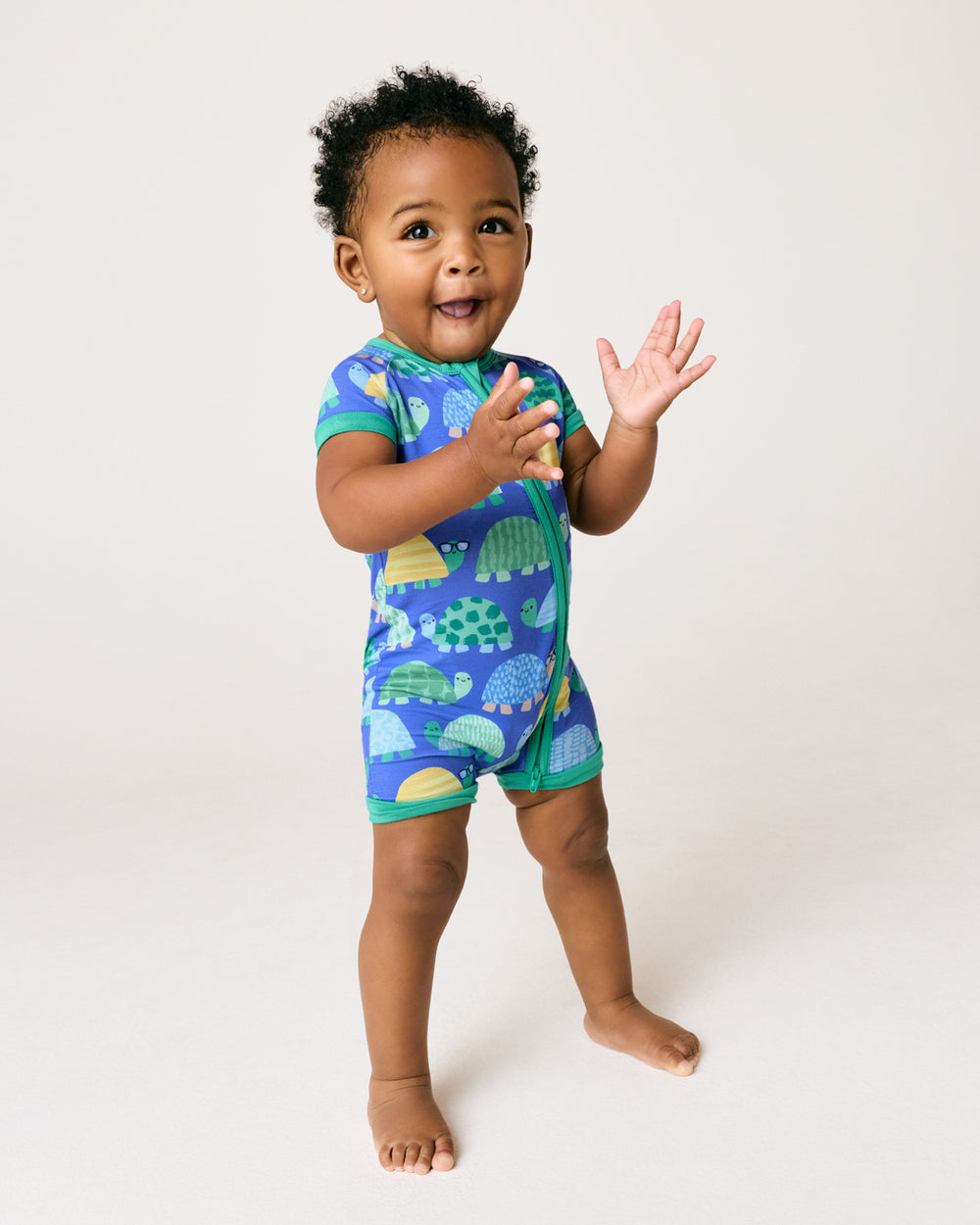 Standing child wearing the Shell Parade Shorty Zippy