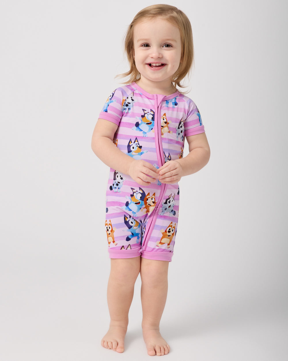 Standing toddler wearing the Pink Bluey Dance All Day Shorty Zippy