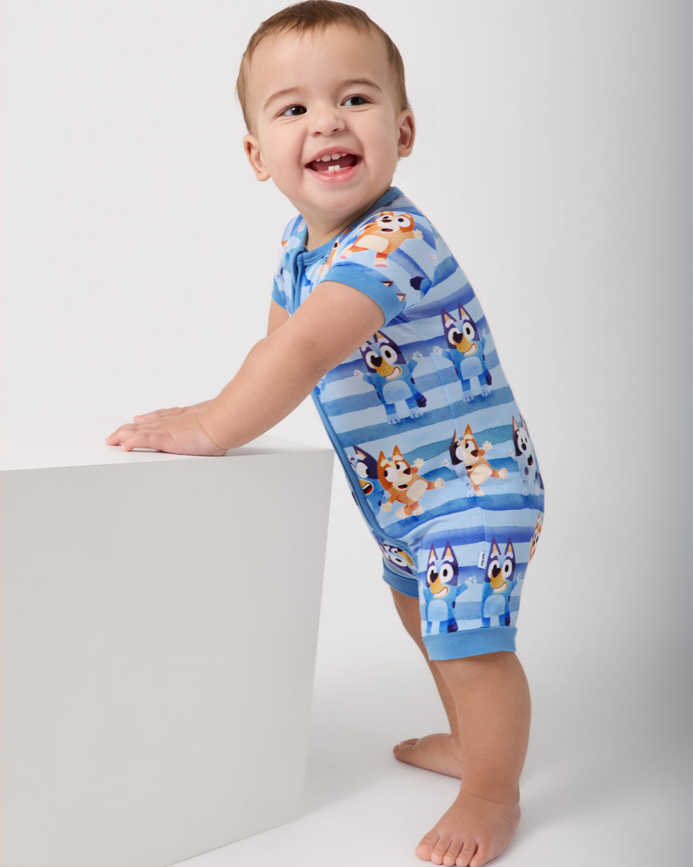 Standing baby wearing the Bluey Dance All Day Shorty Zippy