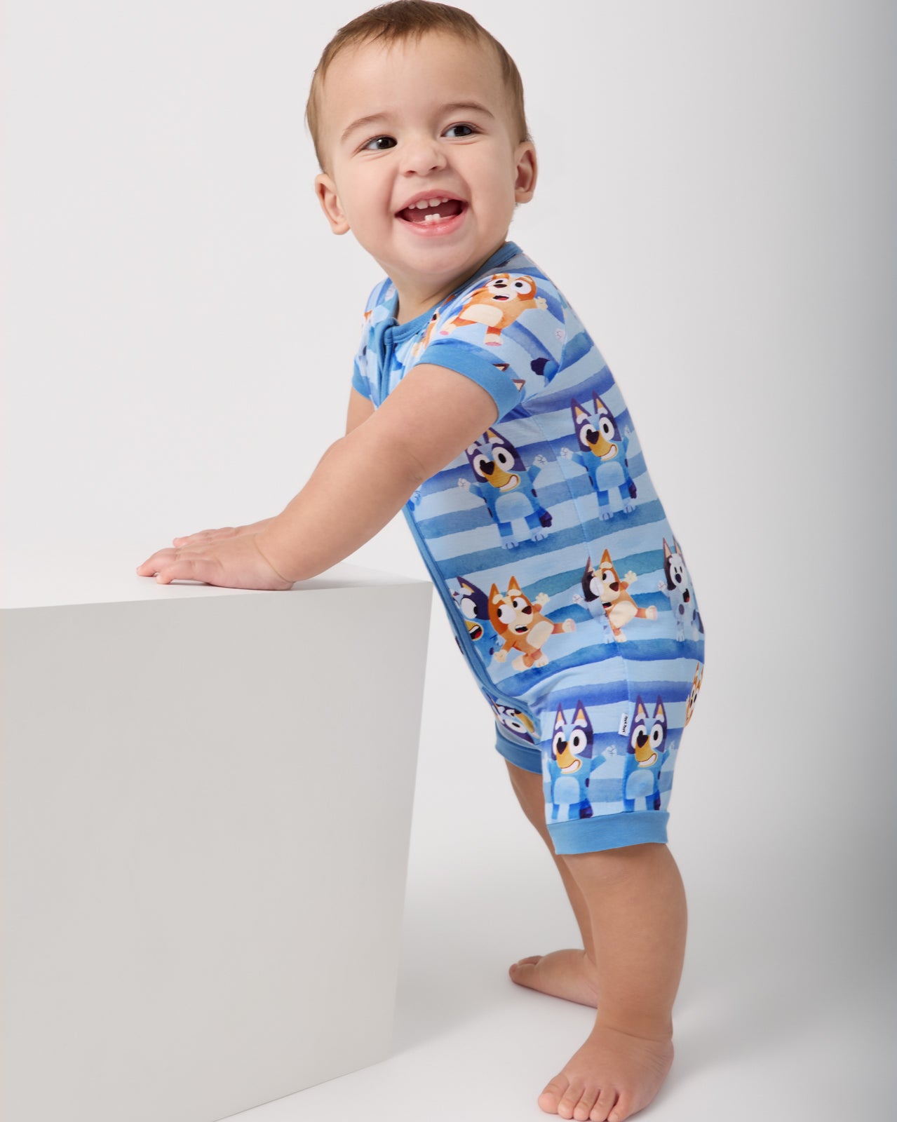 Standing baby wearing the Bluey Dance All Day Shorty Zippy