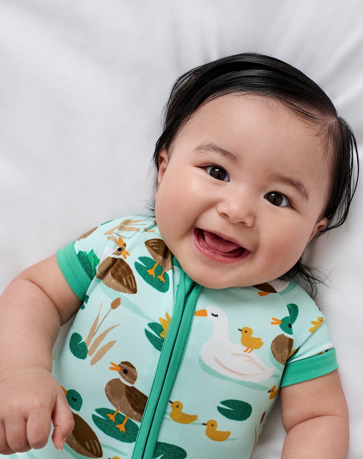Close up of baby wearing the Puddle Jumpers Shorty Zippy