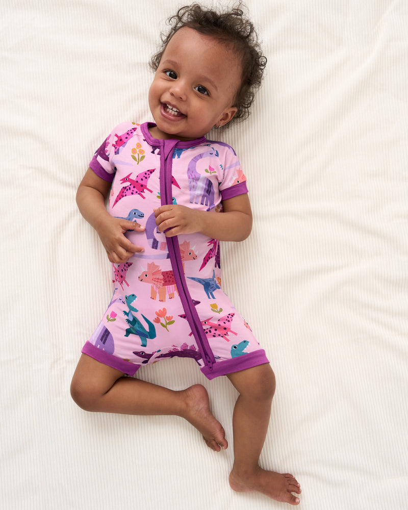 Overhead view of baby wearing the Pink Roar & Explore Shorty Zippy