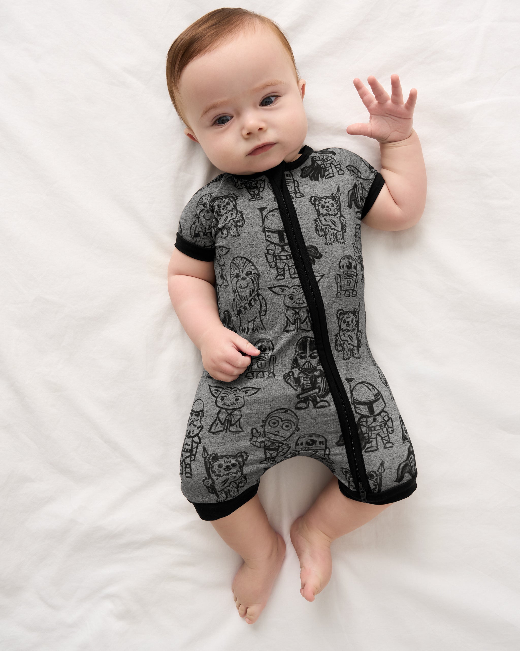 Aerial view of baby wearing the Star Wars Far, Far, Away Friends Shorty Zippy