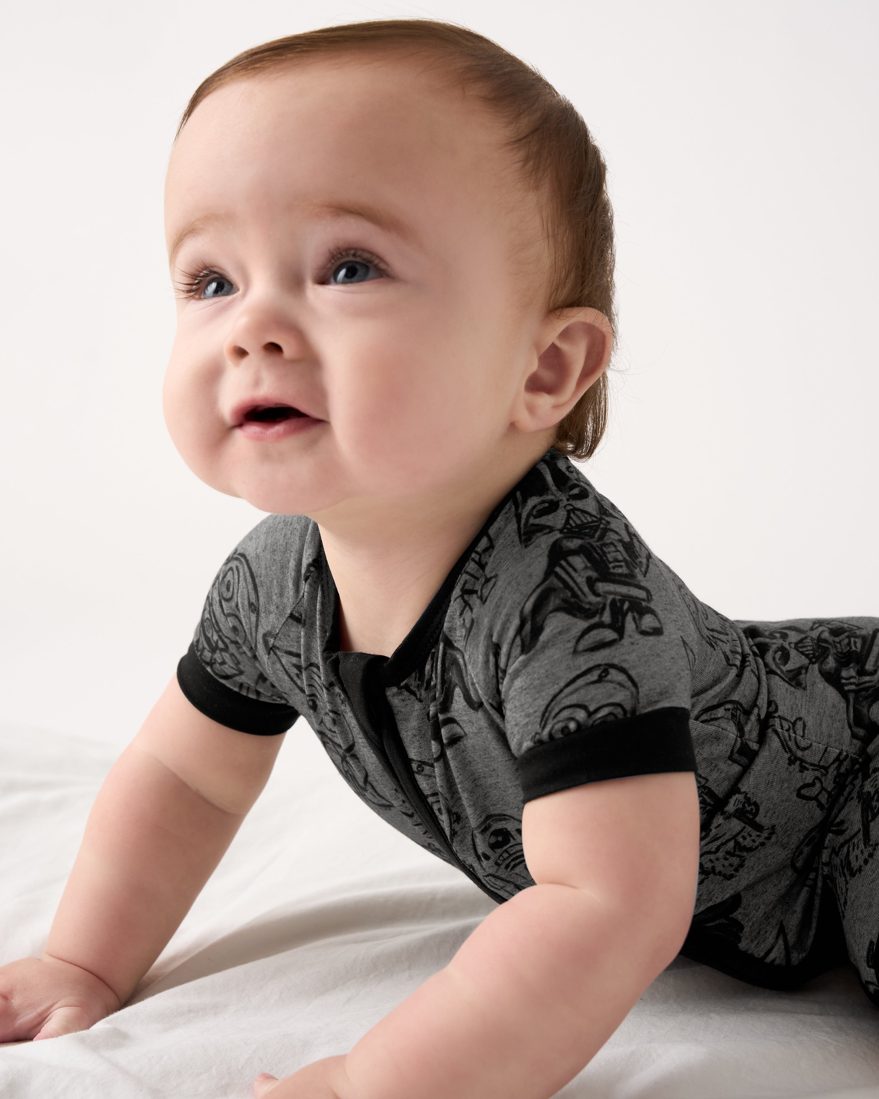 Baby on his tummy wearing the Star Wars Far, Far, Away Friends Shorty Zippy