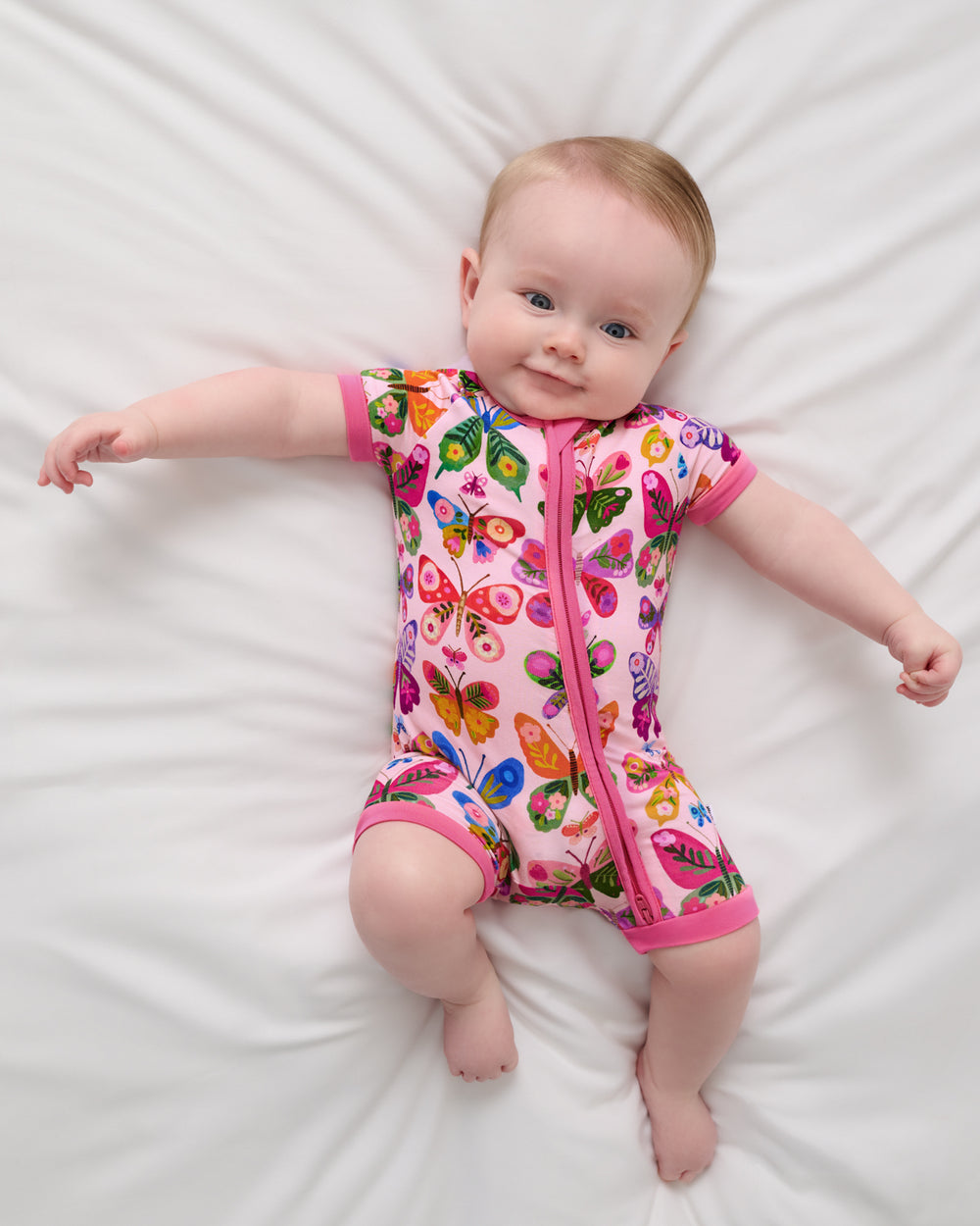 Aerial view of baby wearing the Flutter Garden Shorty Zippy