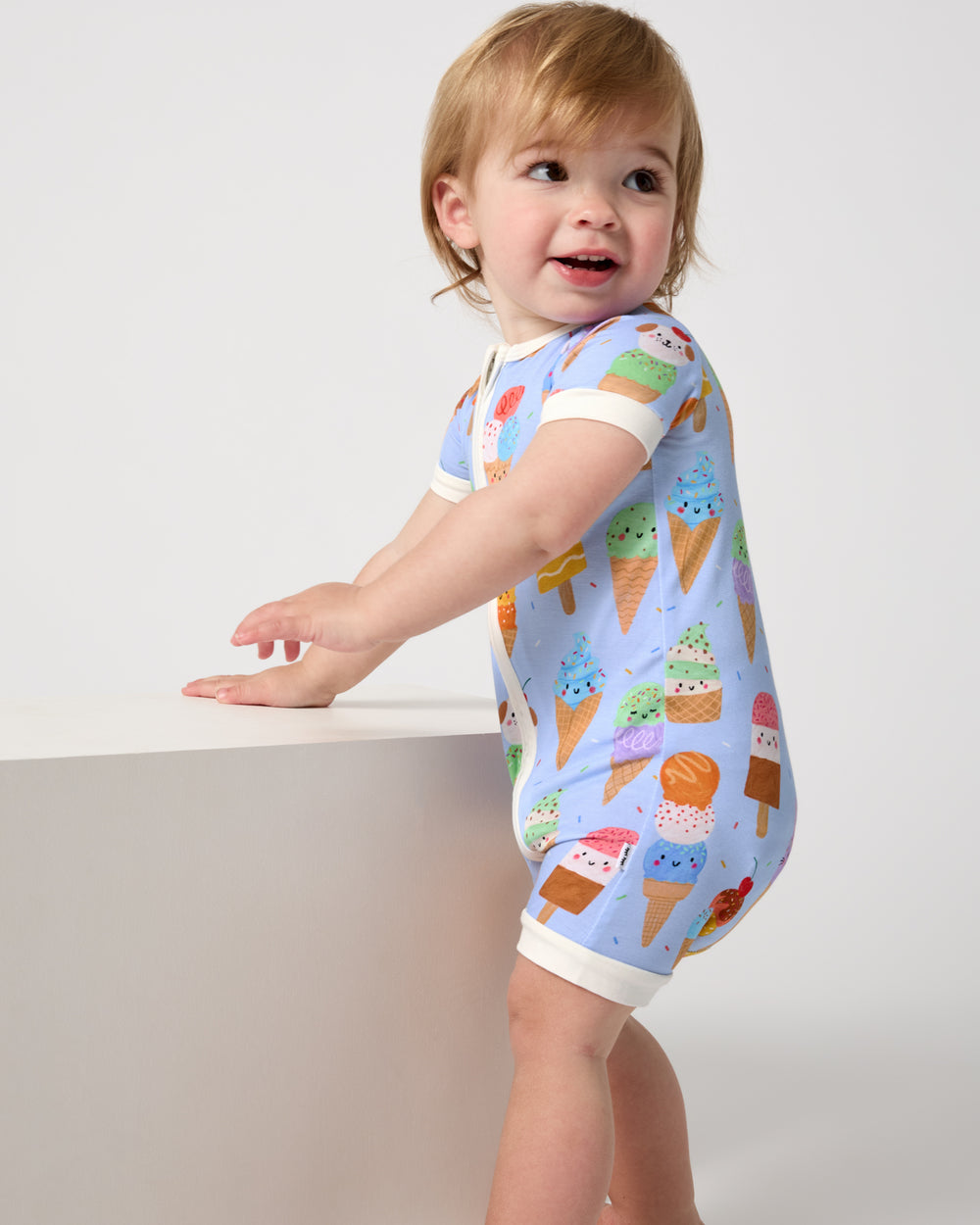 Baby wearing the Scoop Squad Shorty Zippy