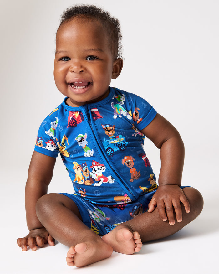 Sitting baby wearing the PAW Patrol Adventure Bay Heroes Shorty Zippy