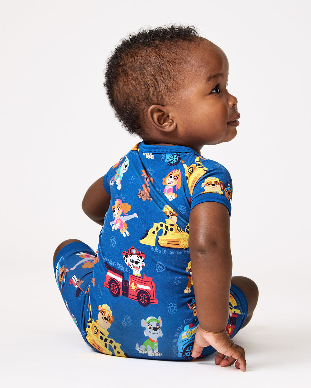 Back view of baby wearing the PAW Patrol Adventure Bay Heroes Shorty Zippy