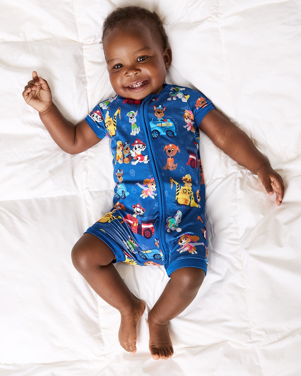 Aerial view of baby wearing the PAW Patrol Adventure Bay Heroes Shorty Zippy