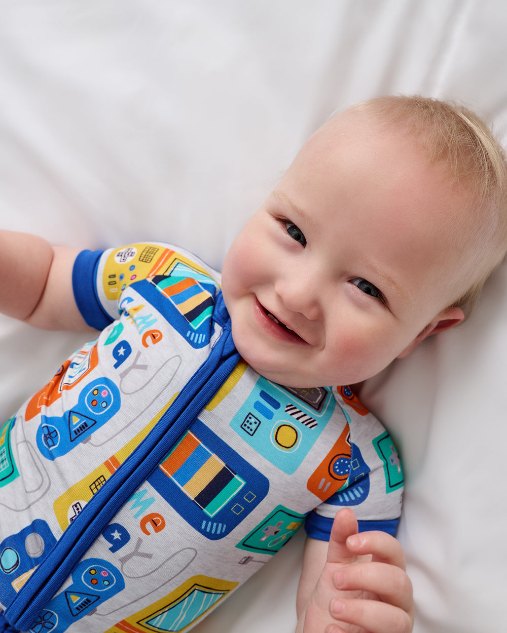 Close up of baby wearing the Game On Shorty Zippy