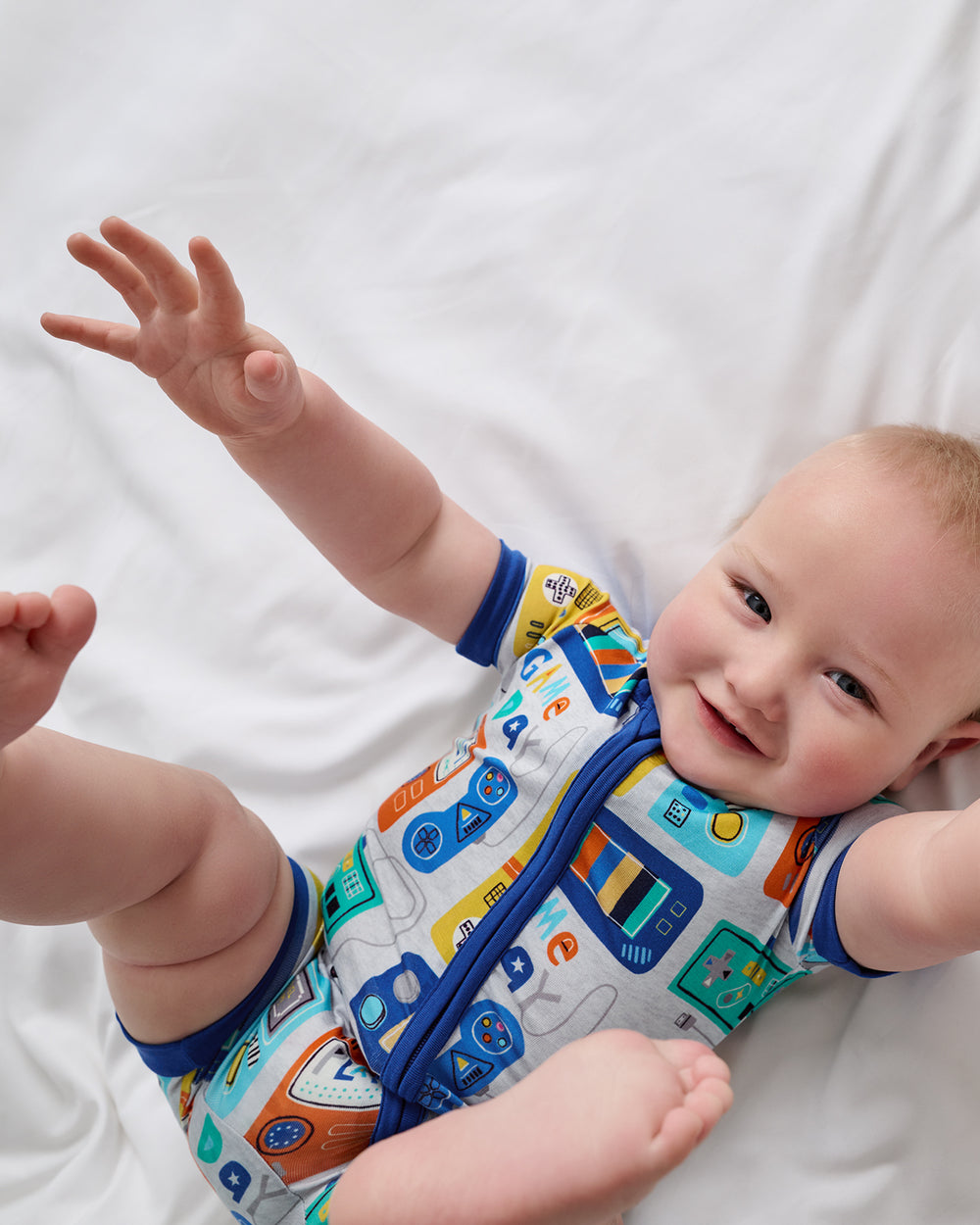 Alternate aerial view of newborn wearing the Game On Shorty Zippy