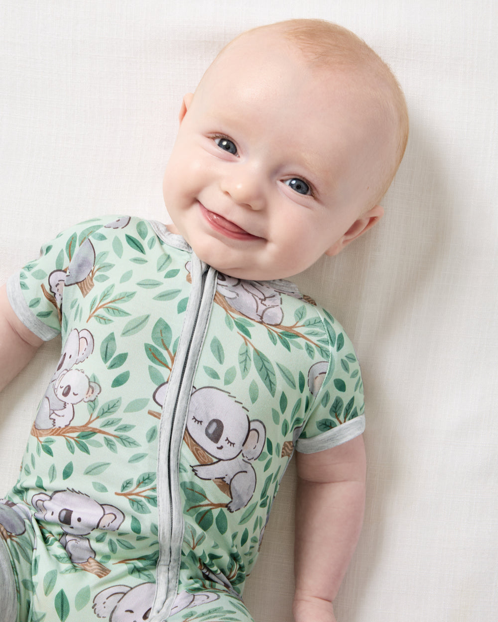 Close up of baby wearing the Koala Cuddles Shorty Zippy